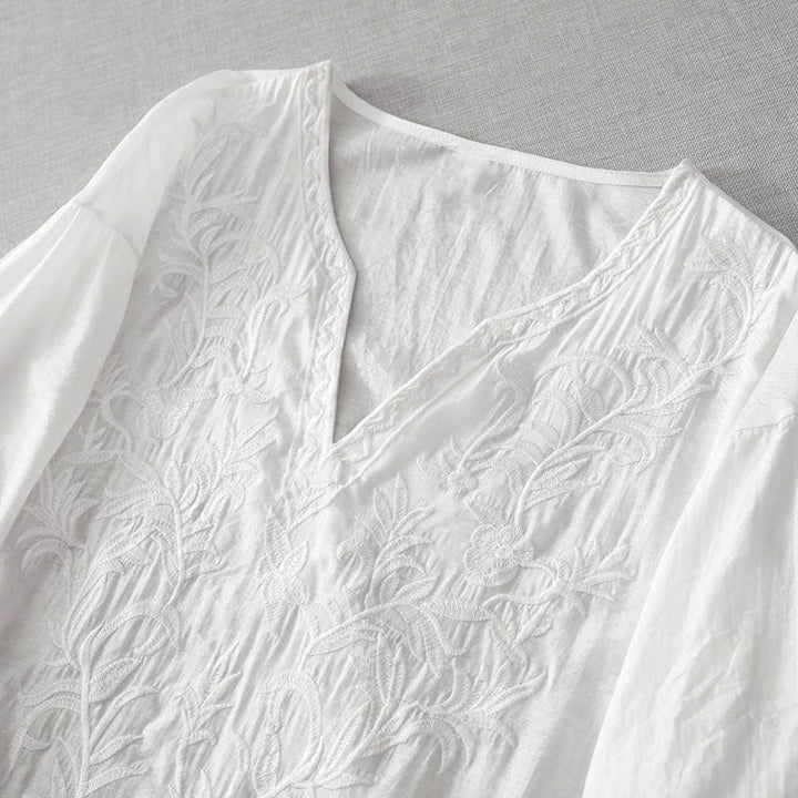 Letnia sukienka midi z haftowanymi liśćmi i kwiatami Buddha Stones w kolorze białym, z krótkim rękawem i dekoltem w serek i kieszeniami - image 2