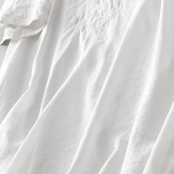 Letnia sukienka midi z haftowanymi liśćmi i kwiatami Buddha Stones w kolorze białym, z krótkim rękawem i dekoltem w serek i kieszeniami - image 6