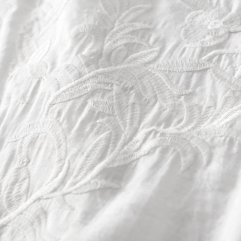 Letnia sukienka midi z haftowanymi liśćmi i kwiatami Buddha Stones w kolorze białym, z krótkim rękawem i dekoltem w serek i kieszeniami - image 4