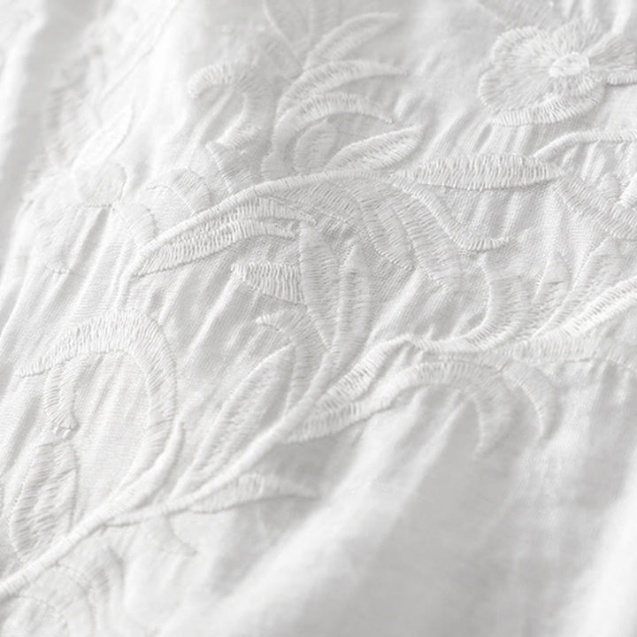 Letnia sukienka midi z haftowanymi liśćmi i kwiatami Buddha Stones w kolorze białym, z krótkim rękawem i dekoltem w serek i kieszeniami - image 4