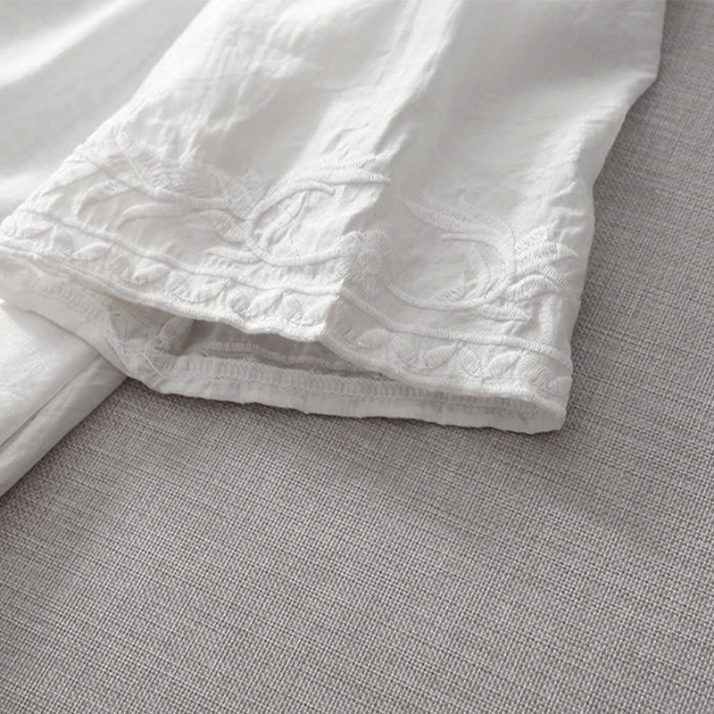 Letnia sukienka midi z haftowanymi liśćmi i kwiatami Buddha Stones w kolorze białym, z krótkim rękawem i dekoltem w serek i kieszeniami - image 10