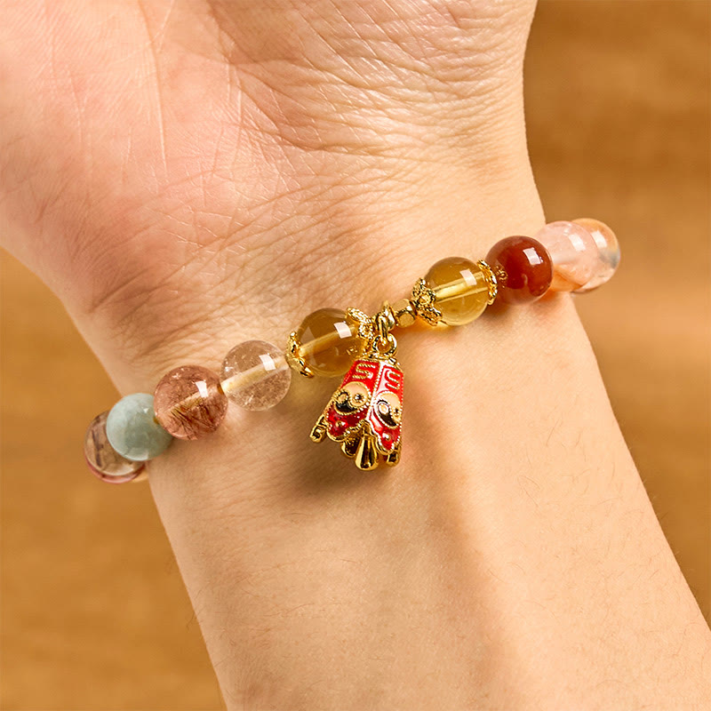 Bransoletka ochronna Yin Yang z naturalnego, kolorowego kwarcu rutylowego z Buddha Stones
