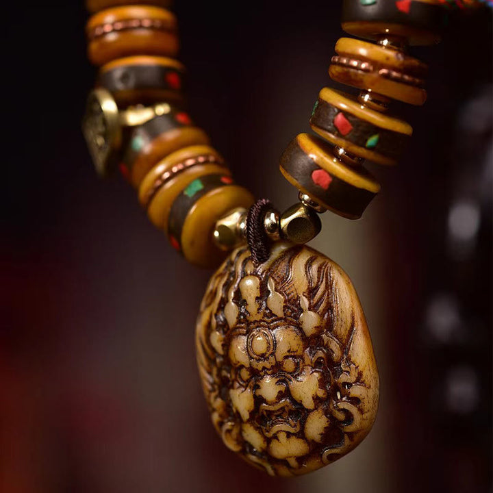 Bransoletka ochronna z frędzlami z kości wielbłąda i Buddha Stones