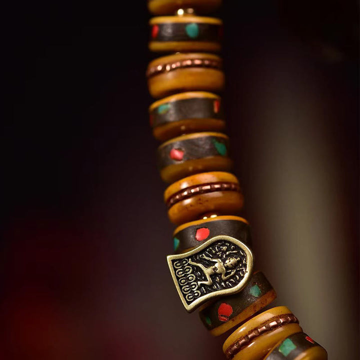 Bransoletka ochronna z frędzlami z kości wielbłąda i Buddha Stones