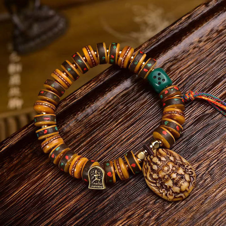 Bransoletka ochronna z frędzlami z kości wielbłąda i Buddha Stones