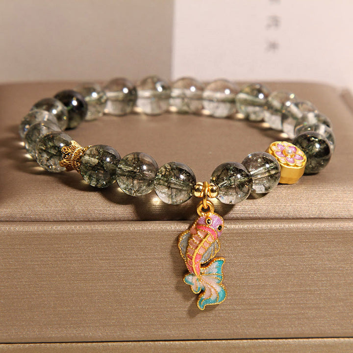 Bransoletka na szczęście z zielonymi Buddha Stones i rybką Koi Phantom