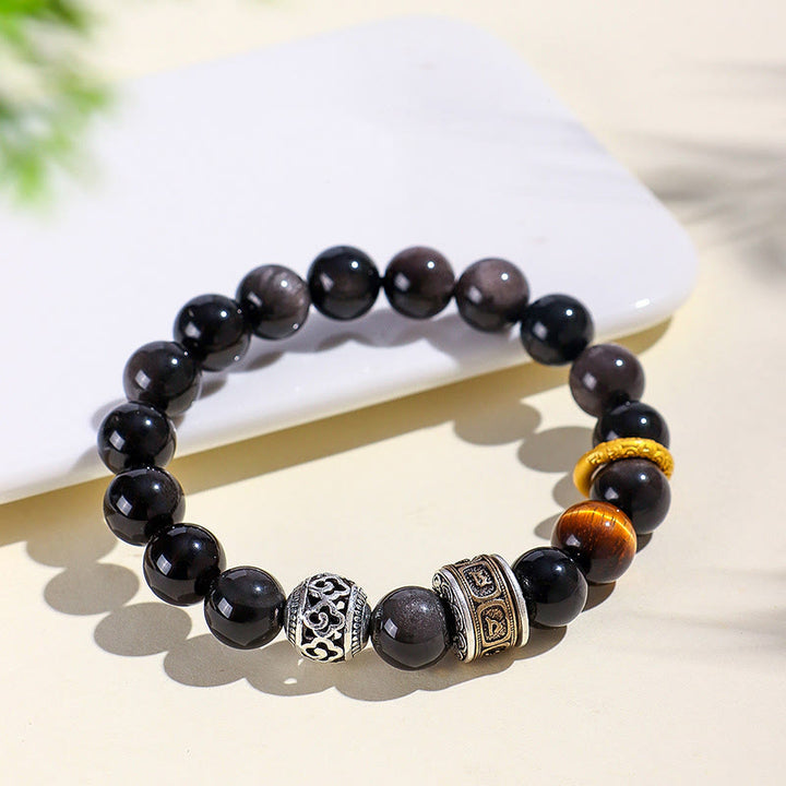 Bransoletka ochronna z Buddha Stones w kolorze srebrnym, obsydianem i tygrysim okiem Om Mani Padme Hum