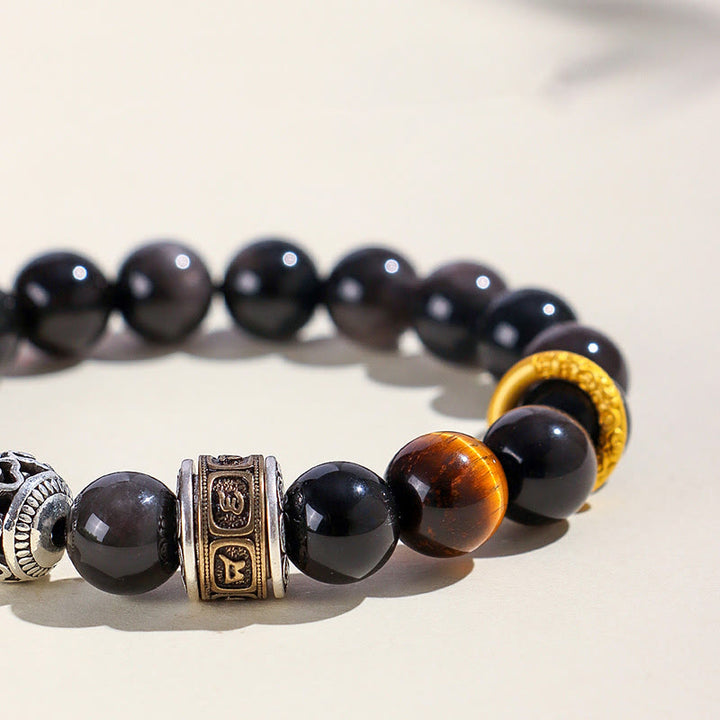 Bransoletka ochronna z Buddha Stones w kolorze srebrnym, obsydianem i tygrysim okiem Om Mani Padme Hum
