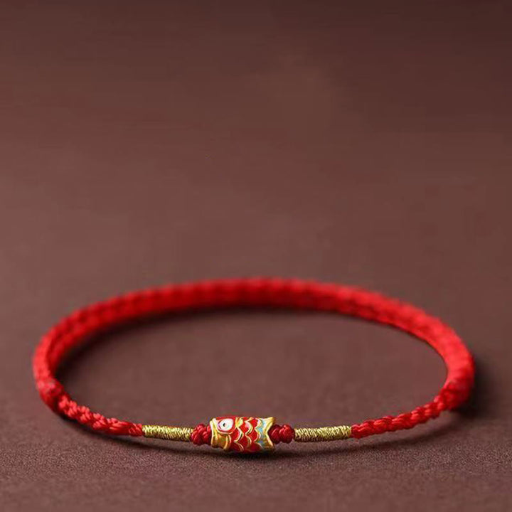 Bransoletka z ręcznie plecionego czerwonego sznurka z motywem ryb Koi w Buddha Stones