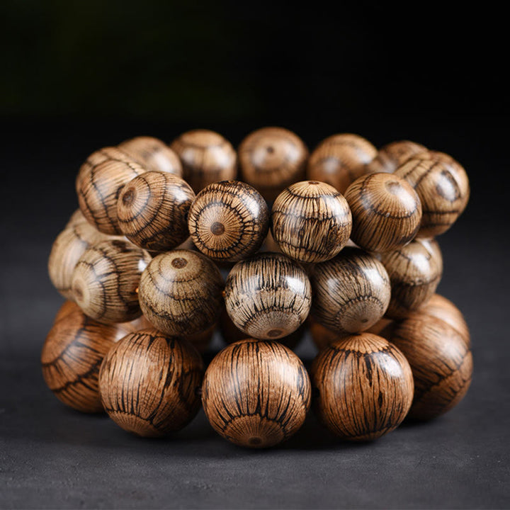 Bransoletka ochronna z koralików z drewna Gnetum z Buddha Stones - image 12