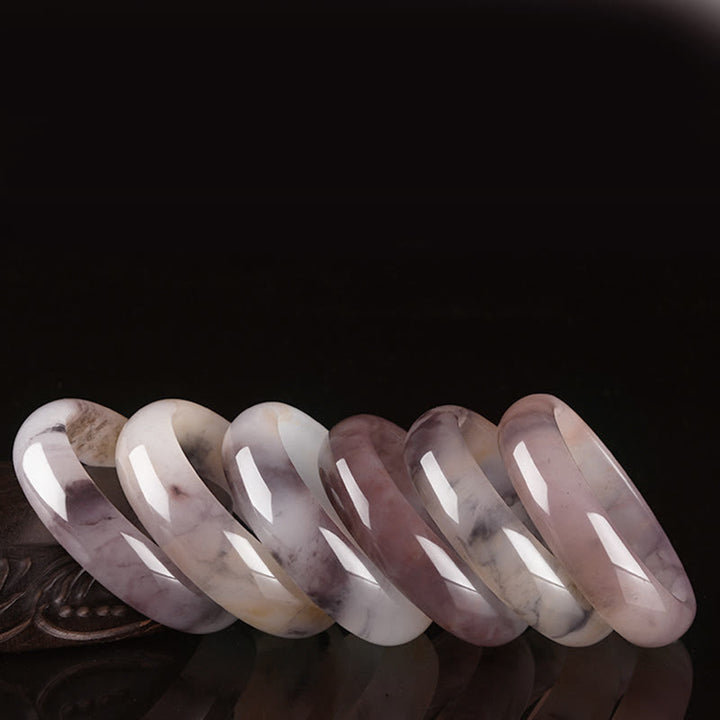Bransoletka ochronna z fioletowym jadeitem i Buddha Stones