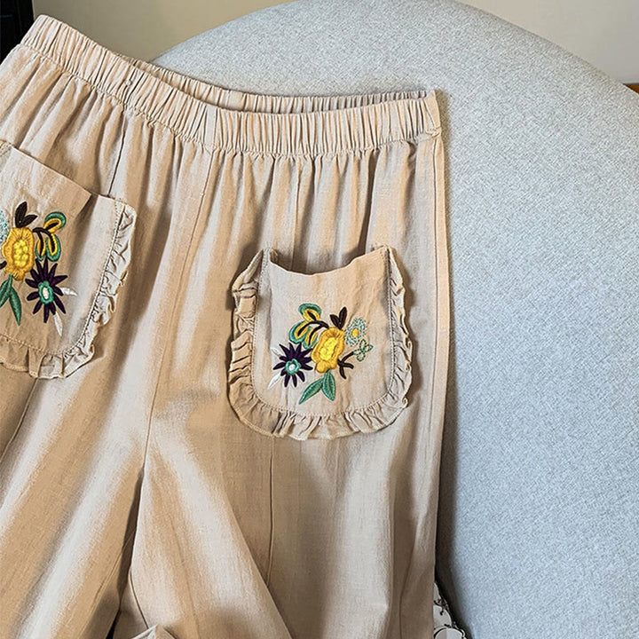 Damskie spodnie lniane z szerokimi nogawkami i kieszeniami, w beżowym kolorze z haftem i motywem Buddha Stones - image 5
