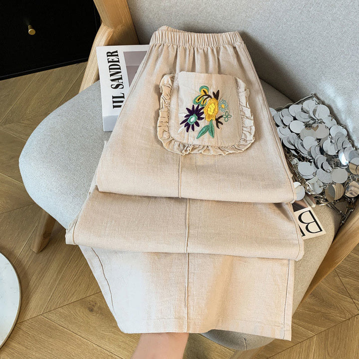 Damskie spodnie lniane z szerokimi nogawkami i kieszeniami, w beżowym kolorze z haftem i motywem Buddha Stones - image 3