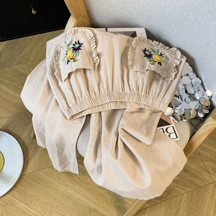 Damskie spodnie lniane z szerokimi nogawkami i kieszeniami, w beżowym kolorze z haftem i motywem Buddha Stones - image 2