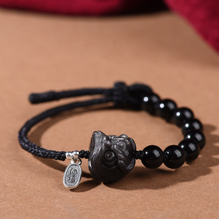Bransoletka Buddha Stones z czarnego obsydianu i srebrnego połysku z obsydianu z uroczym kotem i tańczącym lwem - Tańczący Lew (obwód nadgarstka 14-16 cm) - image 7