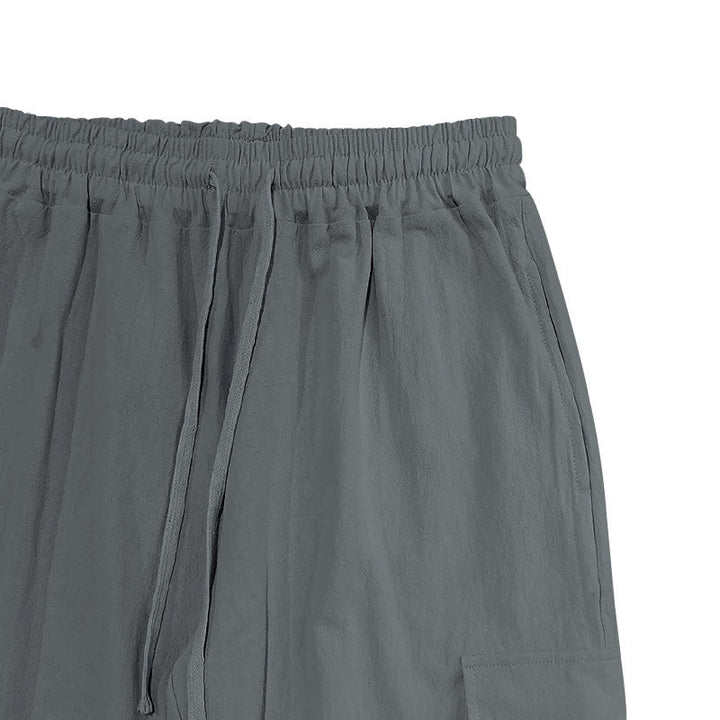 Spodnie cargo męskie z kieszeniami i ściągaczem z motywem Buddha Stones w jednolitym kolorze z lnu - image 17