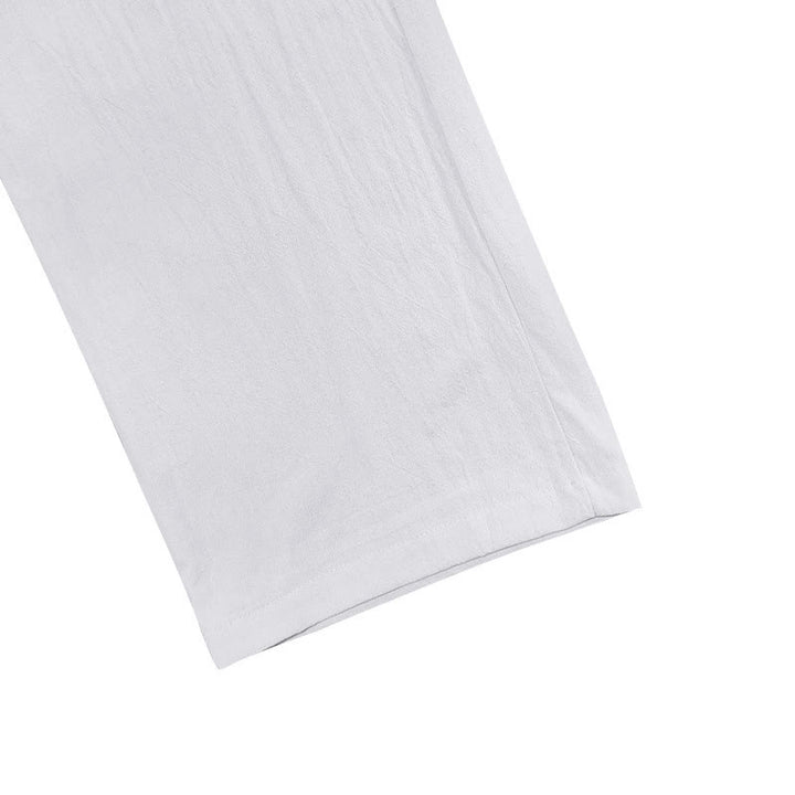 Spodnie męskie bawełniane z kieszeniami i guzikami w jednolitym kolorze z motywem Buddha Stones - image 4