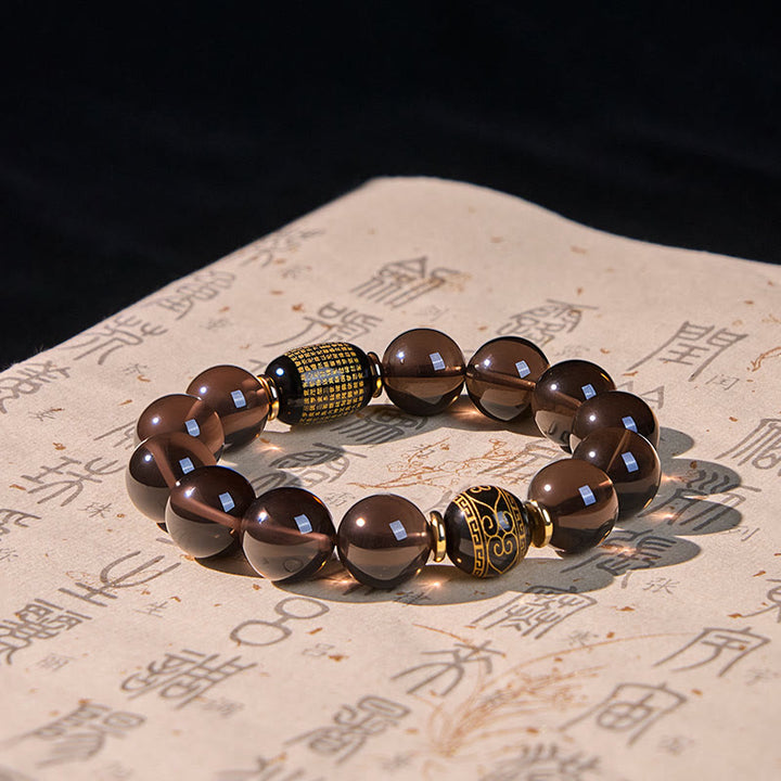 Bransoletka z Buddha Stones z obsydianu lodowego, ze złotym stemplem sanskryckim i motywem odwagi