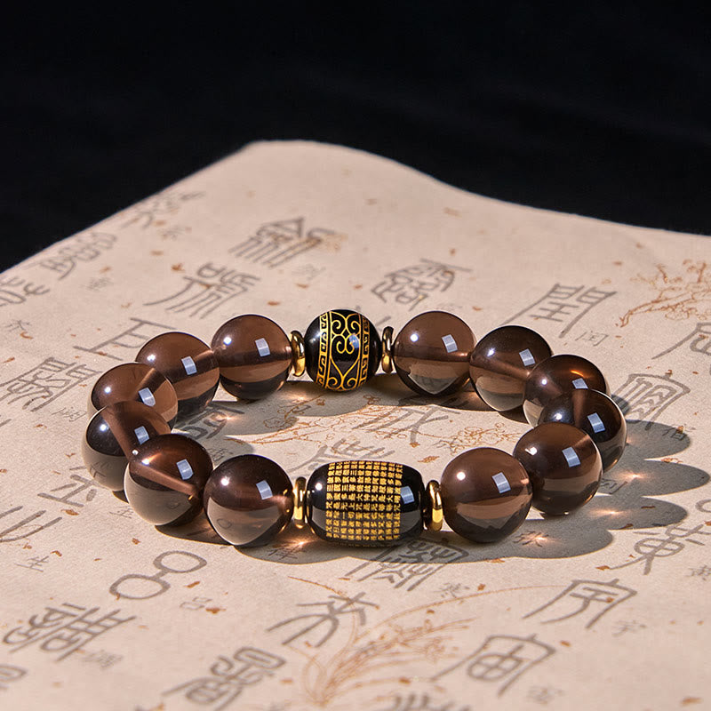 Bransoletka z Buddha Stones z obsydianu lodowego, ze złotym stemplem sanskryckim i motywem odwagi