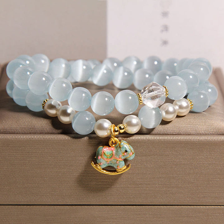 Bransoletka z podwójnym owinięciem i zawieszką w kształcie konia trojańskiego z niebieskimi kocimi oczami i Buddha Stones - Kocie oko (obwód nadgarstka 14-15 cm) - image 1