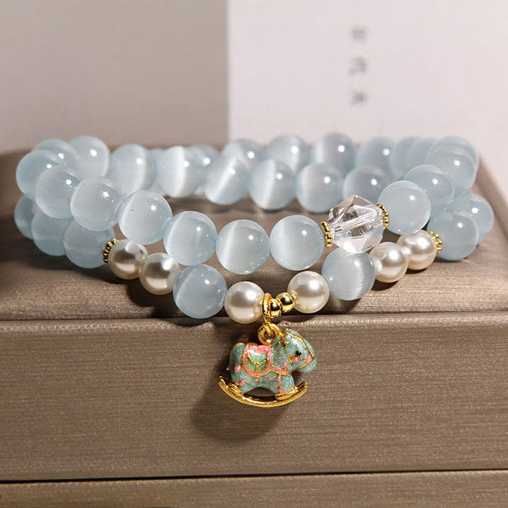 Bransoletka z podwójnym owinięciem i zawieszką w kształcie konia trojańskiego z niebieskimi kocimi oczami i Buddha Stones - image 4