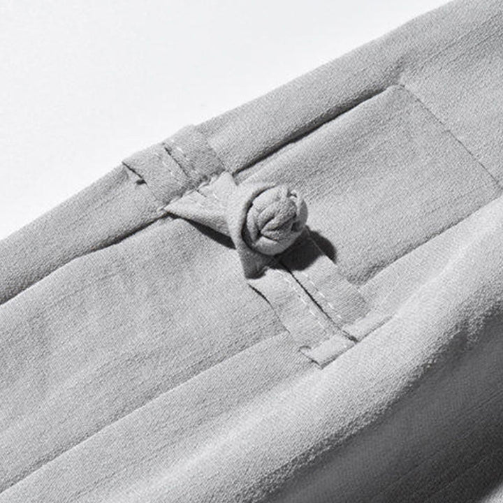 Spodnie męskie z szerokimi nogawkami i kieszeniami, w swobodnym stylu patchworkowym z motywem żurawia i żabich guzików z motywem Buddha Stones - image 25