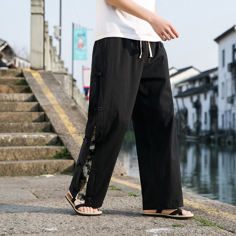 Spodnie męskie z szerokimi nogawkami i kieszeniami, w swobodnym stylu patchworkowym z motywem żurawia i żabich guzików z motywem Buddha Stones - image 1