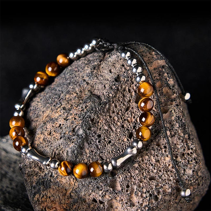 Bransoletka z Buddha Stones z uroczym wzorem kości i tygrysim okiem - Tygrysie oko i stal tytanowa (obwód nadgarstka: 15-21 cm) - image 1