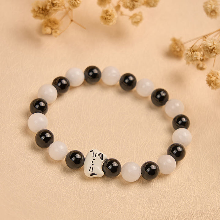 Bransoletka z Buddha Stones , dwukolorowy kot, czarny onyks, biały chalcedon, przynosząca szczęście - image 1