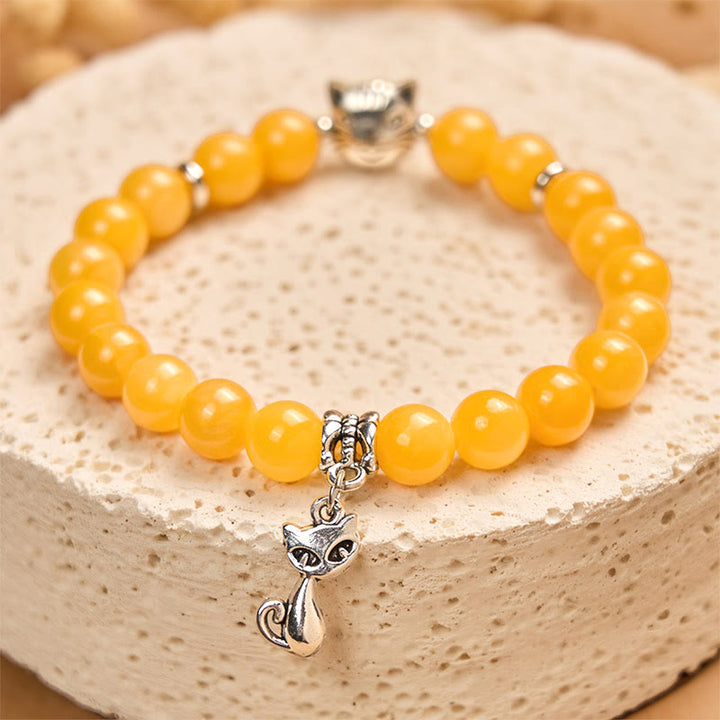Bransoletka z Buddha Stones z pomarańczowym pręgowanym kotem i żółtym chalcedonem - image 1