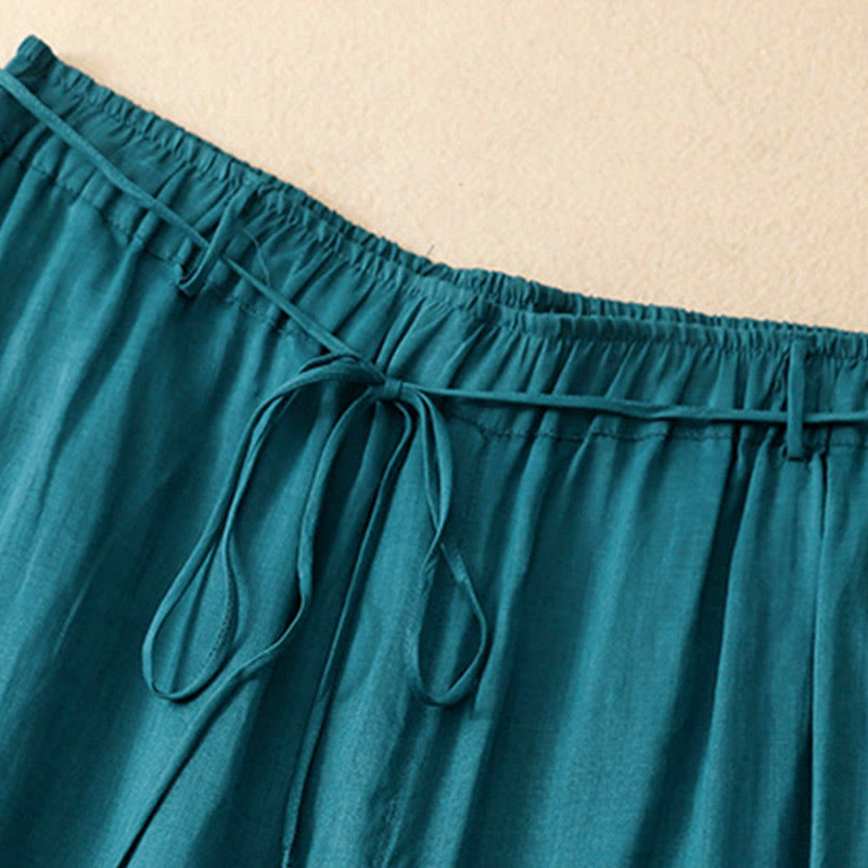 Spodnie damskie z szerokimi nogawkami i kieszeniami, proste, z bawełny, z nadrukiem "Buddha Stones", ze ściągaczem - image 1