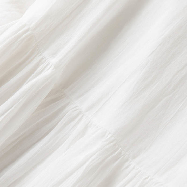 Letnia sukienka midi z bawełny z dekoltem w serek i krótkim rękawem "Buddha Stones" - image 21