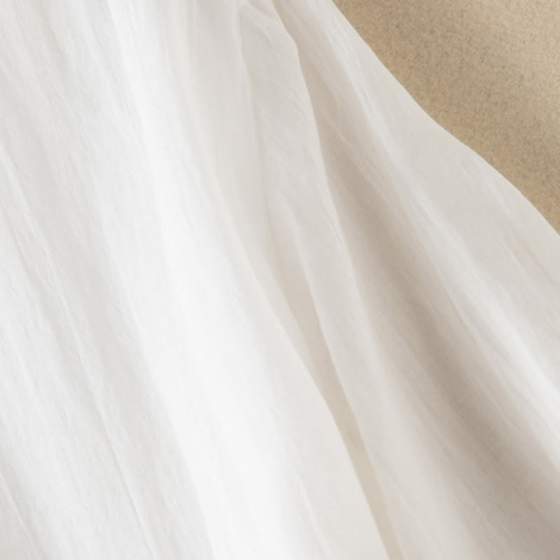 Letnia sukienka midi z bawełny z dekoltem w serek i krótkim rękawem "Buddha Stones" - image 33