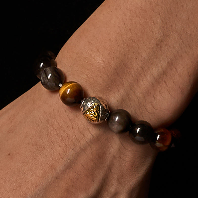 Bransoletka ochronna z naturalnego, srebrnego obsydianu z tygrysim okiem i trzema twarzami Buddha Stones - image 3