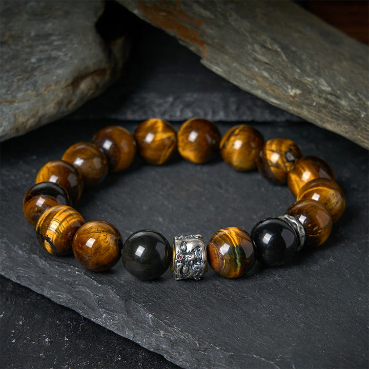 Bransoletka ochronna na głowę Buddy z Buddha Stones, tygrysim okiem i srebrnym połyskiem obsydianu - Tygrysie oko (obwód nadgarstka 16-18 cm) - image 0