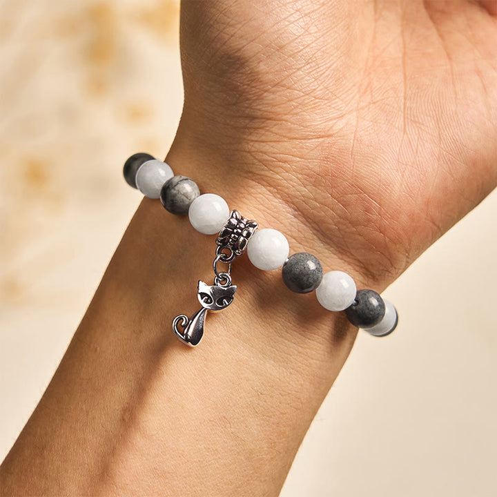 Bransoletka stabilizująca z naturalnego czarnego jaspisu z Buddha Stones w kolorze szarym i pręgowanym z białego chalcedonu - image 4