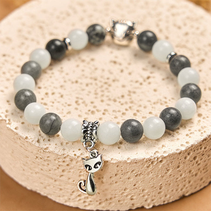 Bransoletka stabilizująca z naturalnego czarnego jaspisu z Buddha Stones w kolorze szarym i pręgowanym z białego chalcedonu - image 2