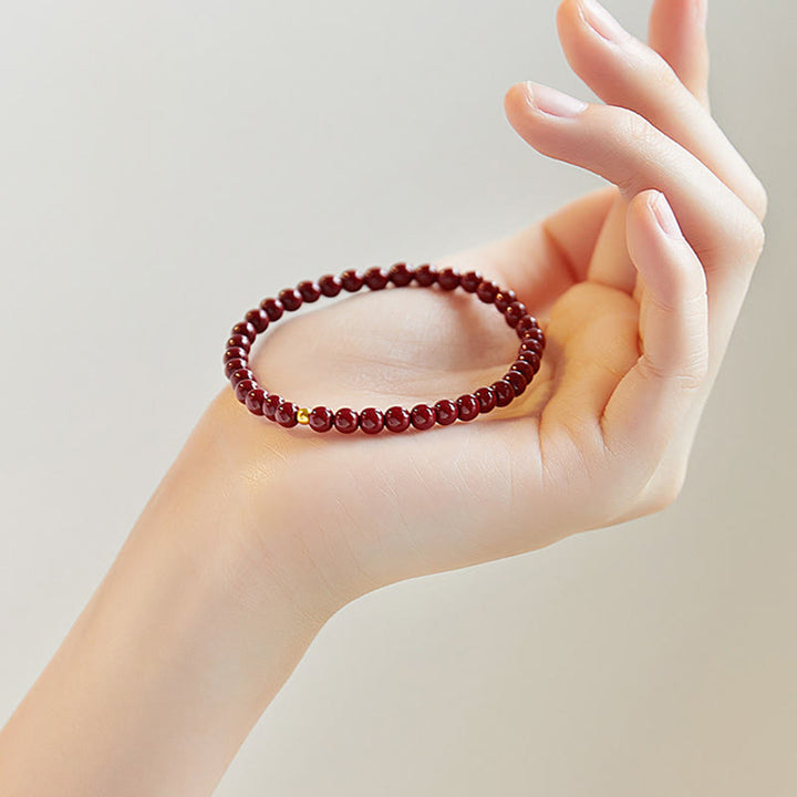 Bransoletka z błogosławieństwem z Buddha Stones ze srebra próby 925 i koralików cynobrowych - image 1