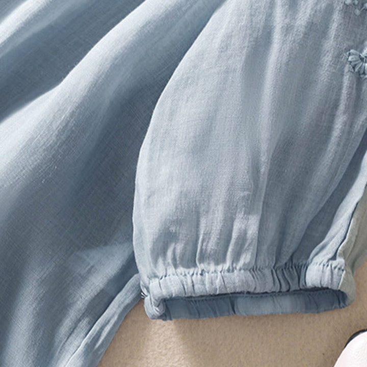 Koszula damska z bufiastymi rękawami i krótkim rękawem "Buddha Stones" w swobodnym, prostym fasonie z guzikami i kwiatowym haftem - image 3