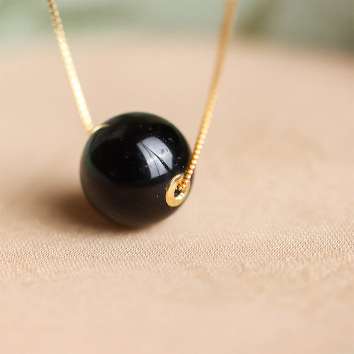 Naszyjnik z wisiorkiem "Buddha Stones" ze srebra próby 925 i bursztynowych koralików, z motywem skupienia i pewności siebie - image 3