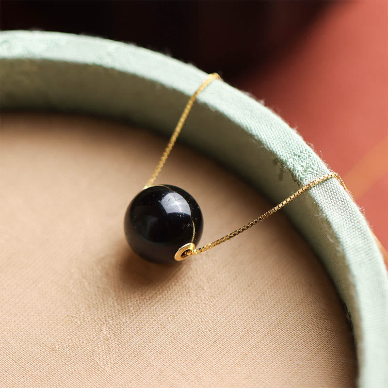 Naszyjnik z wisiorkiem "Buddha Stones" ze srebra próby 925 i bursztynowych koralików, z motywem skupienia i pewności siebie - image 1