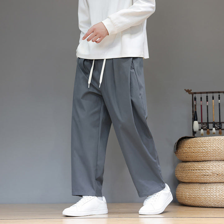 Męskie spodnie haremowe z kieszeniami i prostymi nogawkami w jednolitym kolorze z motywem Buddha Stones - image 0