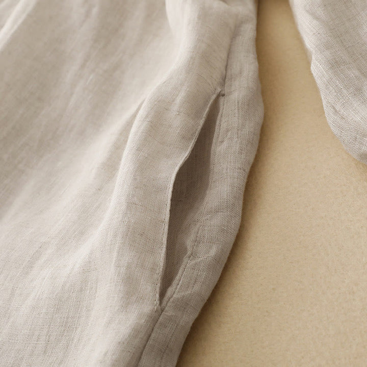 Sukienka midi z bawełny z długimi rękawami i kieszeniami, w kolorze beżowym z motywem Buddha Stones, z guzikami i klapami - image 4