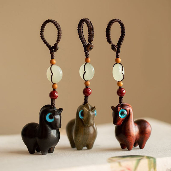 Buddha Stones Rok Konia Mały liść Czerwony sandałowiec Zielony sandałowiec Hebanowy uspokajający brelok - image 1