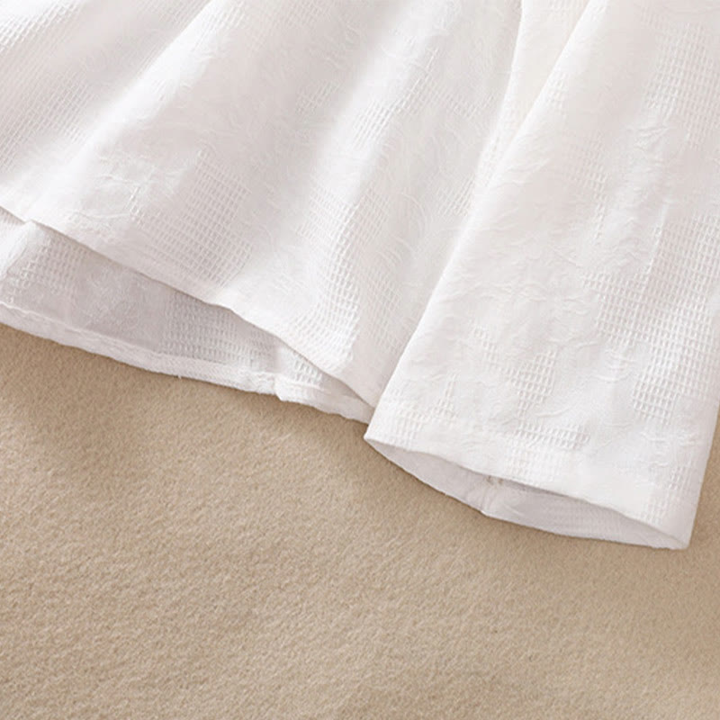 Koszula damska z długim rękawem z bawełny z haftem "Jesienne Buddha Stones" w asymetrycznym wzorze i żabą zapinaną na guziki - image 13