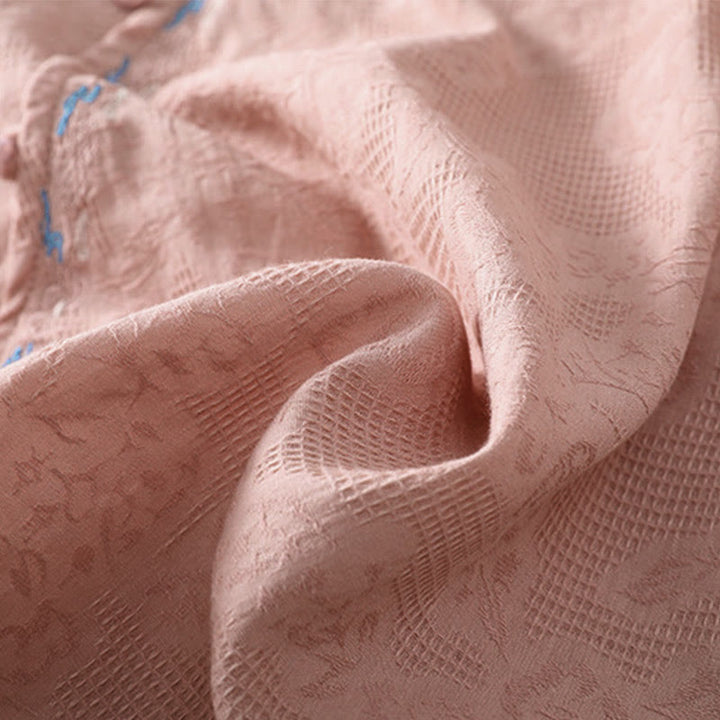 Koszula damska z długim rękawem z bawełny z haftem "Jesienne Buddha Stones" w asymetrycznym wzorze i żabą zapinaną na guziki - image 20