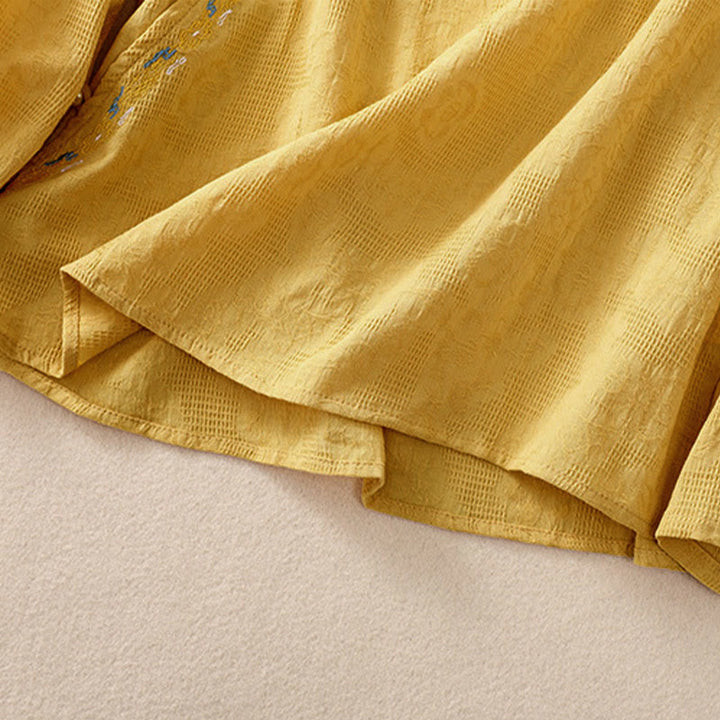 Koszula damska z długim rękawem z bawełny z haftem "Jesienne Buddha Stones" w asymetrycznym wzorze i żabą zapinaną na guziki - image 29