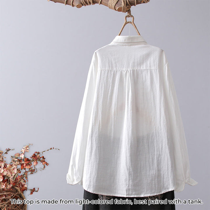 Koszula damska z długim rękawem z bawełny z haftem w geometryczne paski z motywem kamieni Buddha Stones w kolorze białym i kwiatowym - image 1