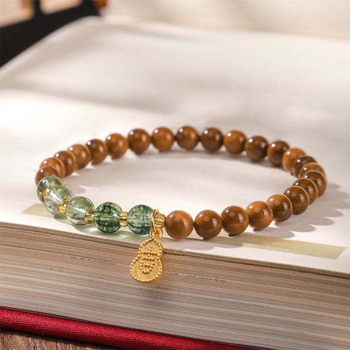 Bransoletka odstraszająca złe duchy z zielonymi fantomowymi Buddha Stones z nasionami Kuki - image 2