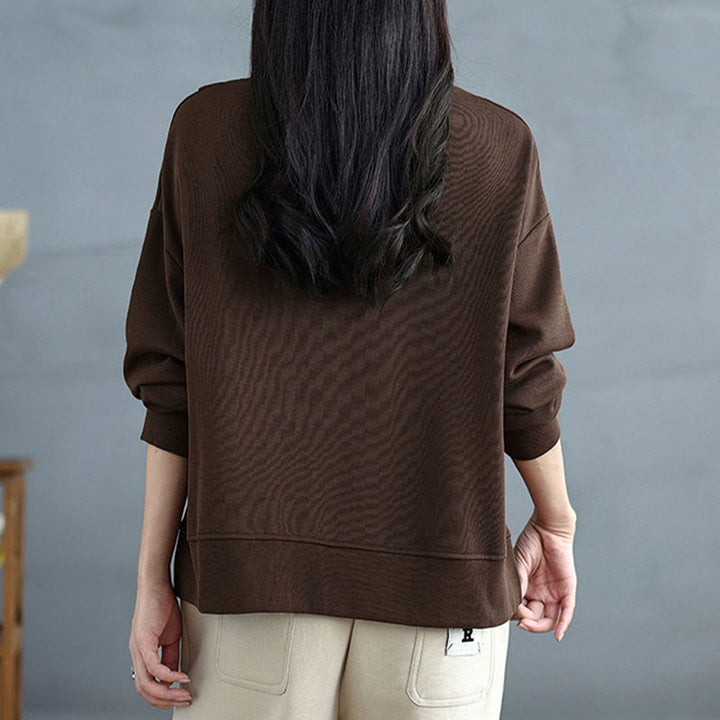 Bluza damska z bawełny z okrągłym dekoltem i długim rękawem w jednolitym kolorze i asymetrycznym wzorem "Buddha Stones Fall" - image 3